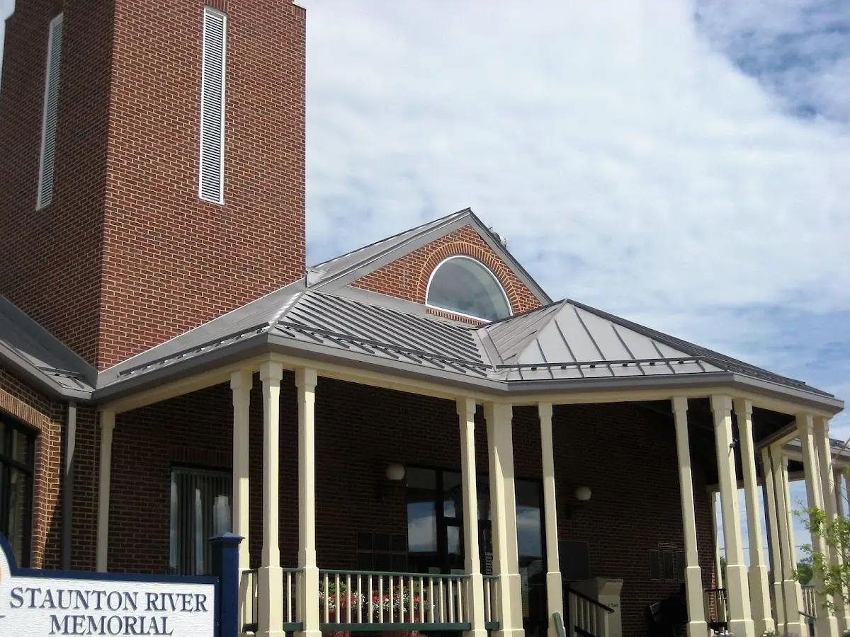 Skilled roofing craftsmen working on a residential roof in Gladstone